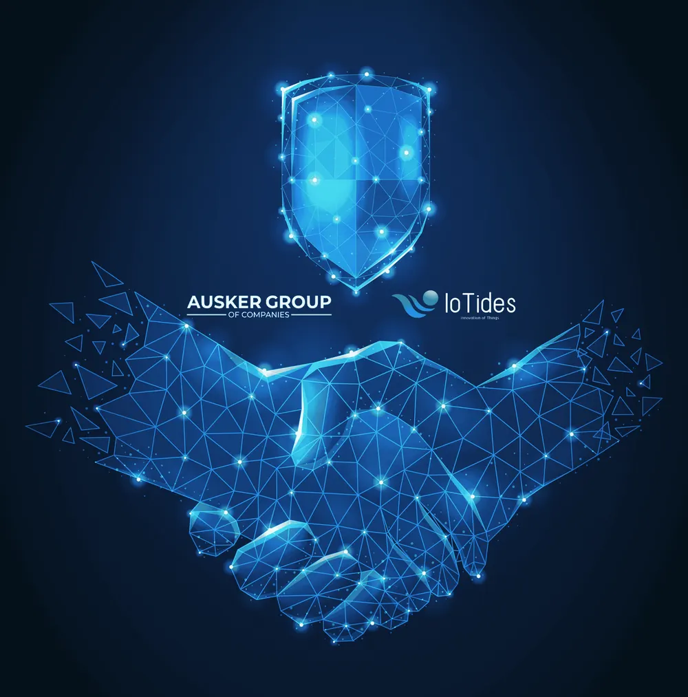 Ausker Group of Companies and IoTides partnership, shown as a handshake beneath a shield